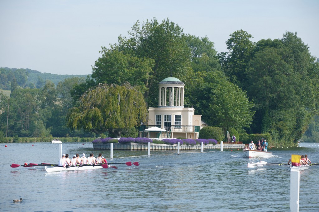 BJ4C09 Two boats rowing passed Temple Island at Henley Regatta