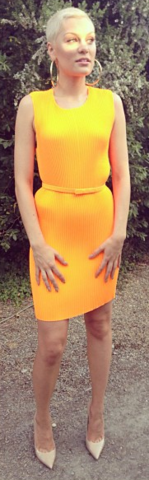 Jessie J proves orange is the new black in the Stella McCartney – Pleated Stretch Dress. Hire this bright dress now from Girl Meets Dress