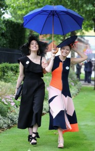 Ascot Flora Macdonald Johnston (R) and Milja Kljajic arrive in the rain